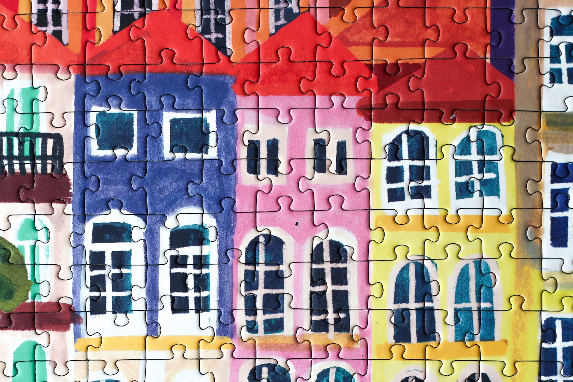 1000-teiliges Puzzle für Erwachsene, dass die bunten Häuser Portos am Wasser zeigt.