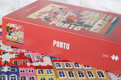 Außergewöhnliches Puzzle für Erwachsene mit 500 Teilen, das die portugiesische Stadt Porto mit ihren bunten Häusern zeigt.