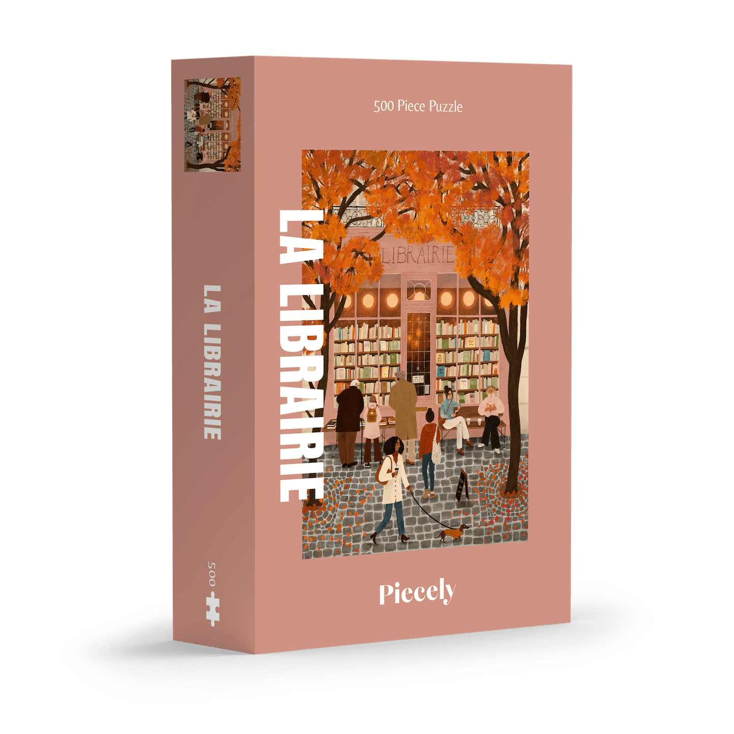 500-Teile-Puzzle „La Librairie“ von Piecely – Illustration einer herbstlichen Pariser Straßenszene vor einer kleinen Buchhandlung, auf rosa-brauner Verpackung.
