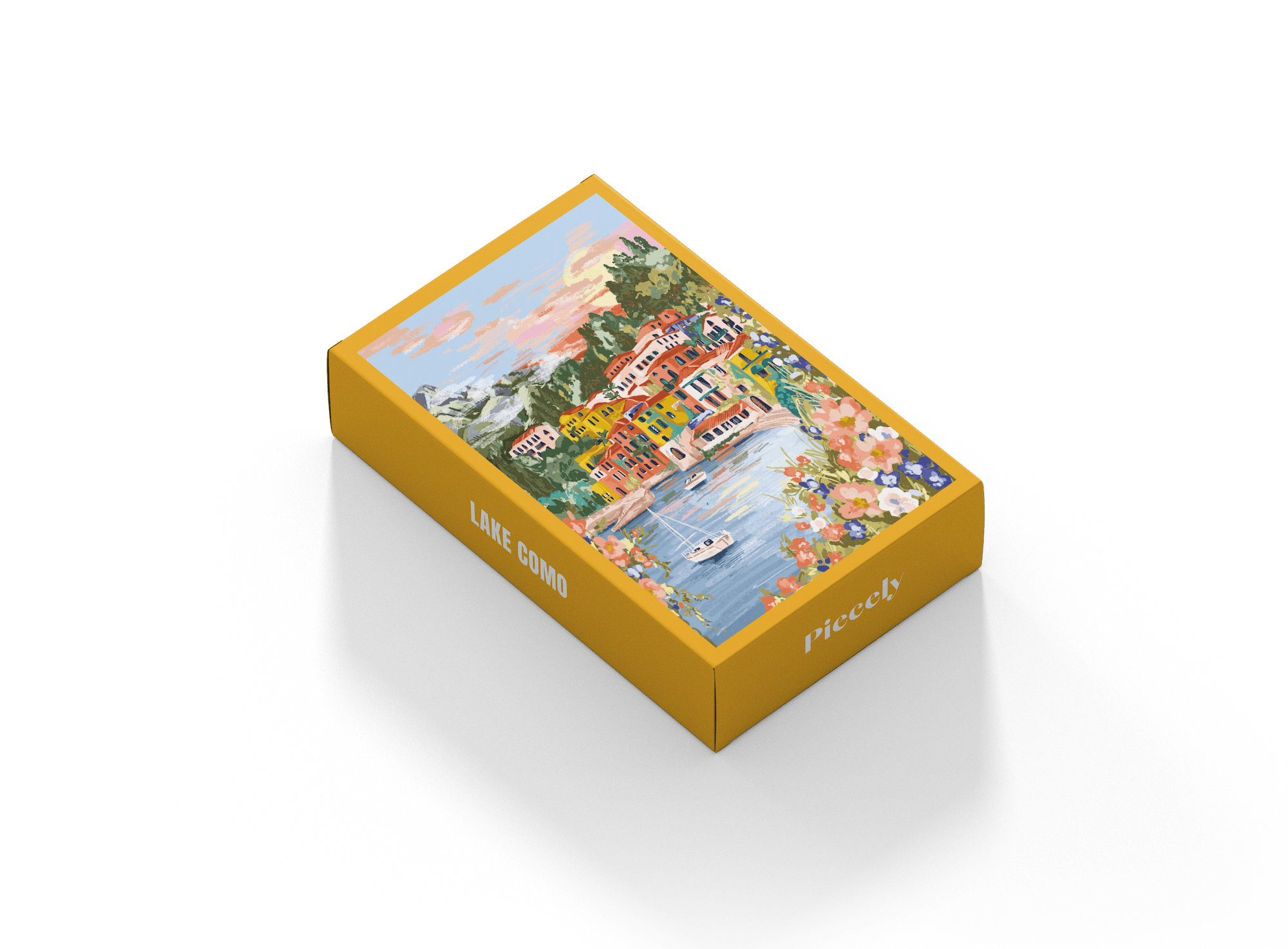 99-teiliges Minipuzzle für Erwachsene, das den Comer See in Varenna zeigt. In der Bucht befinden sich zwei Boote und die Sicht auf den See ist gesäumt von bunten Häusern.