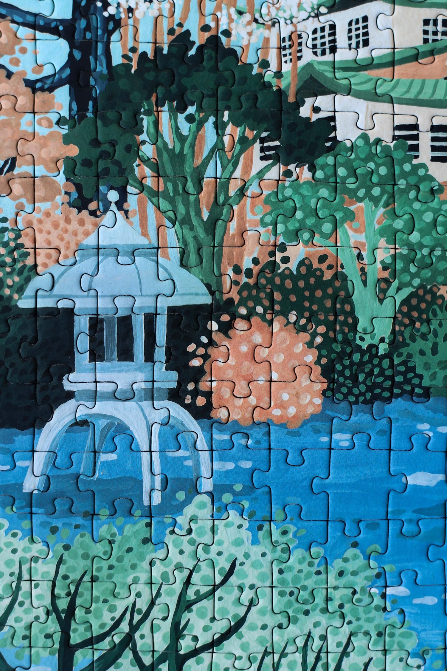 Plastikfreies Puzzle für Erwachsene, das die Burg Osaka in Japan in pastelligen Blau- und Grüntönen zeigt. 