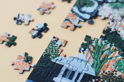 Plastikfreies Puzzle für Erwachsene, das die Burg Osaka in Japan in pastelligen Blau- und Grüntönen zeigt. 