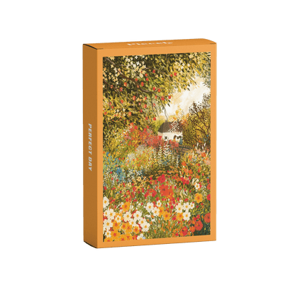 99-teiliges Perfect Day Minipuzzle für Erwachsene, das ein Pärchen beim Picknick umgeben von farbenfrohen Blumen zeigt.