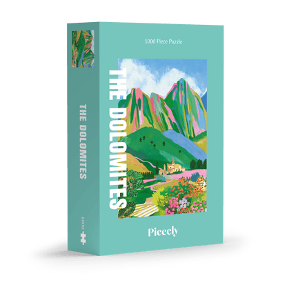 1000-Teile-Puzzle „The Dolomites“ von Piecely – Illustration einer farbenfrohen Berglandschaft in den Dolomiten mit Dorf und Blumen, auf türkisfarbener Verpackung.