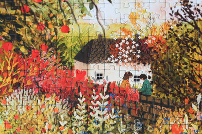 Nachhaltiges Puzzle, das ein Meer aus Blumen, einen Apfelbaum und Pärchen und ein kleines Haus zeigt.