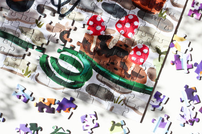 Nachhaltiges Puzzle mit 1000 Teilen, das ein Gewächshaus mit riesigen Stiefmütterchen und einer Gärtnerin zeigt.