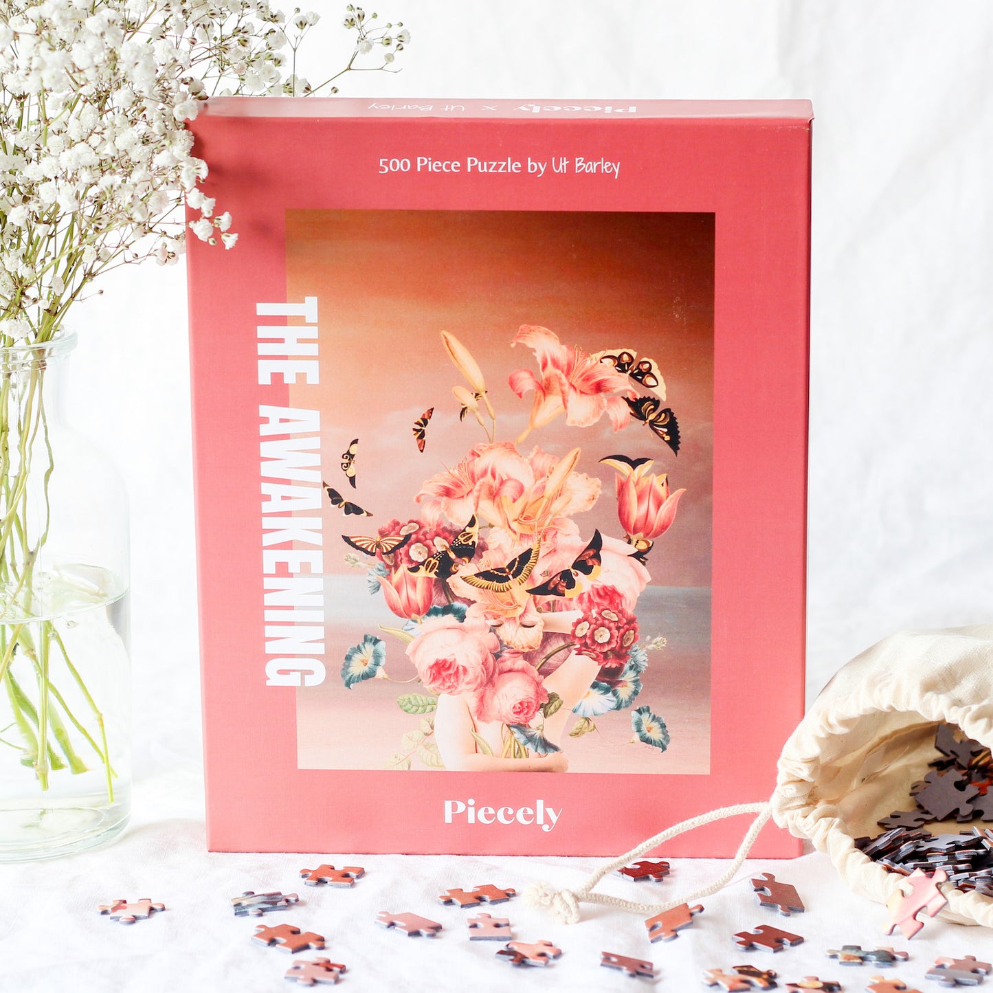 500-teiliges The Awakening Puzzle, das eine Collage aus einer Frau, Blumen und Schmetterlingen vor einem Farbverlauf zeigt. 